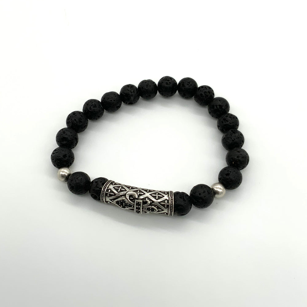 
                  
                    Black lava rock bracelet with a large silver accent bead in front and 2 smaller accent beads on either side 
                  
                