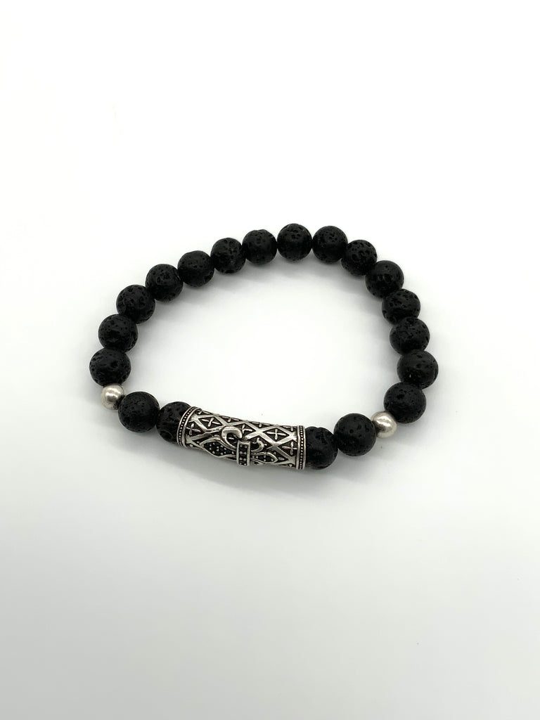 Black lava rock bracelet with a large silver accent bead in front and 2 smaller accent beads on either side 