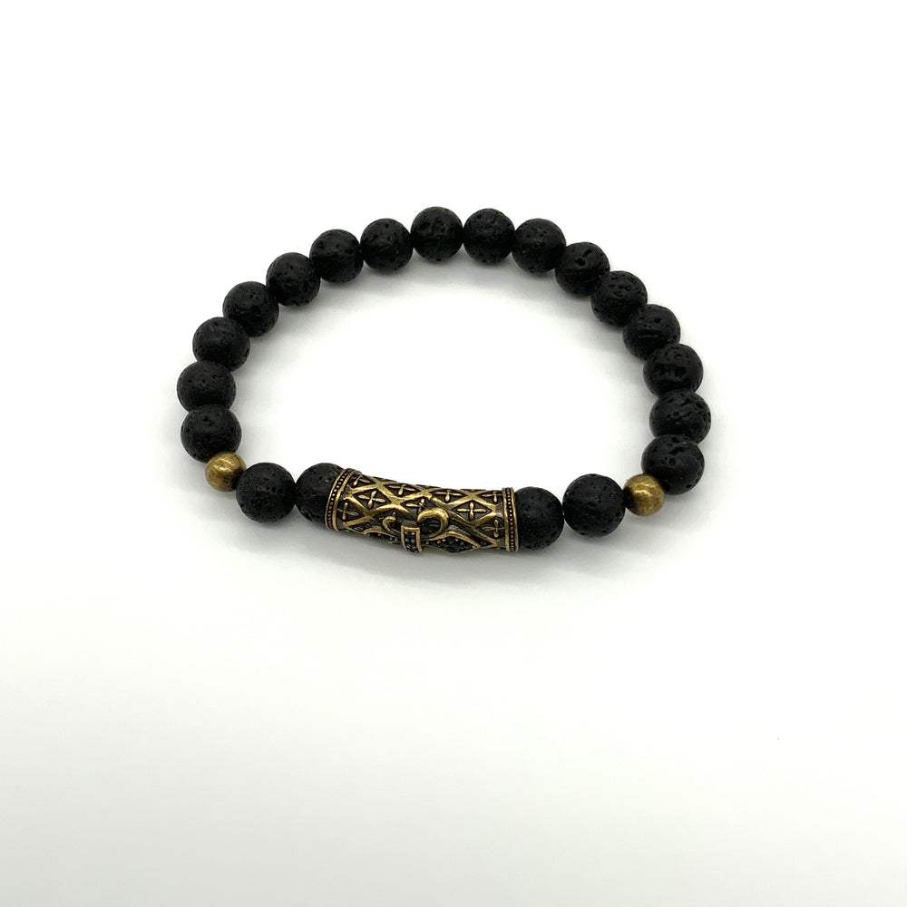 
                  
                    Black lava rock bracelet with a large gold accent bead in front and 2 smaller accent beads on either side 
                  
                